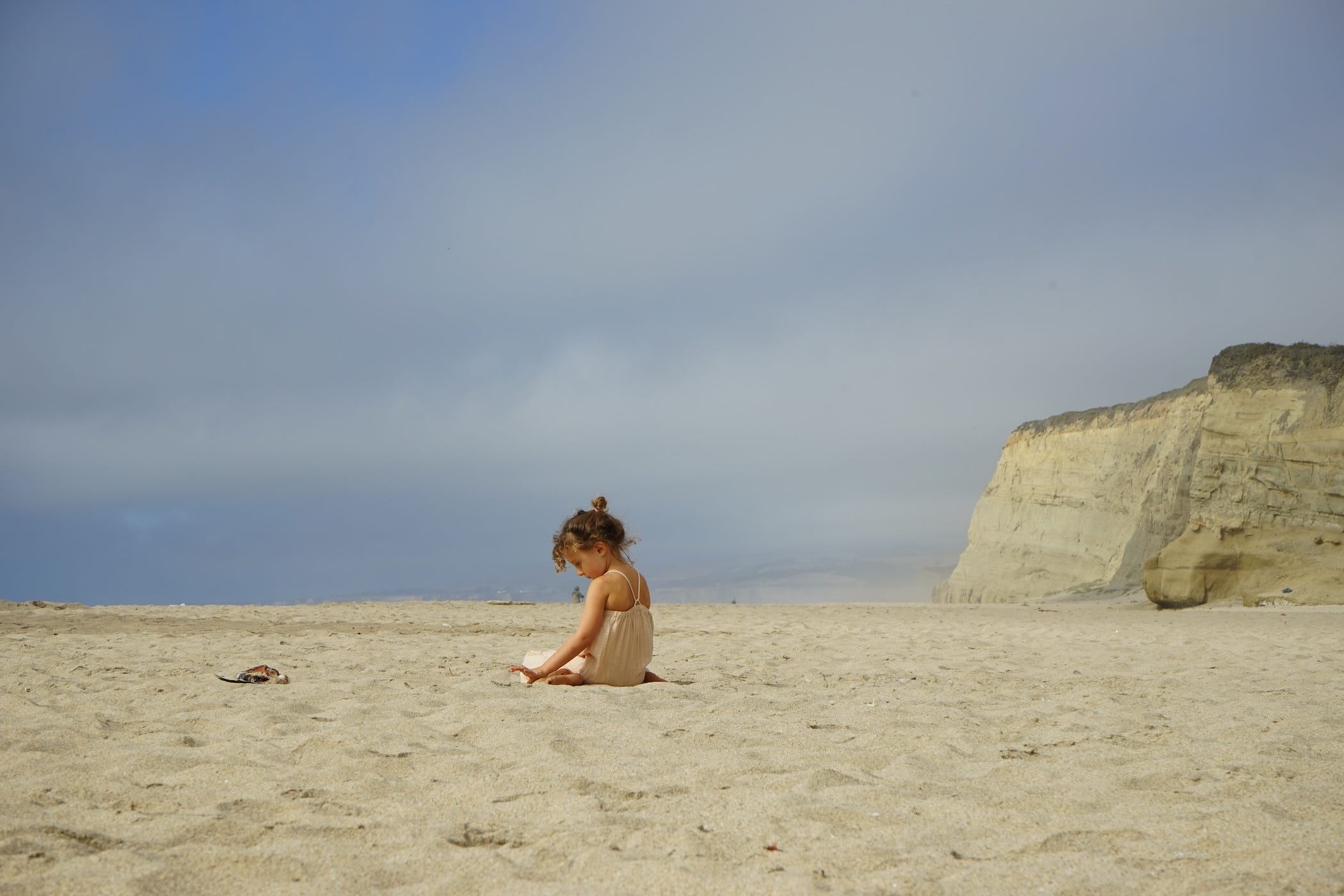 david's daughter playing on the beach