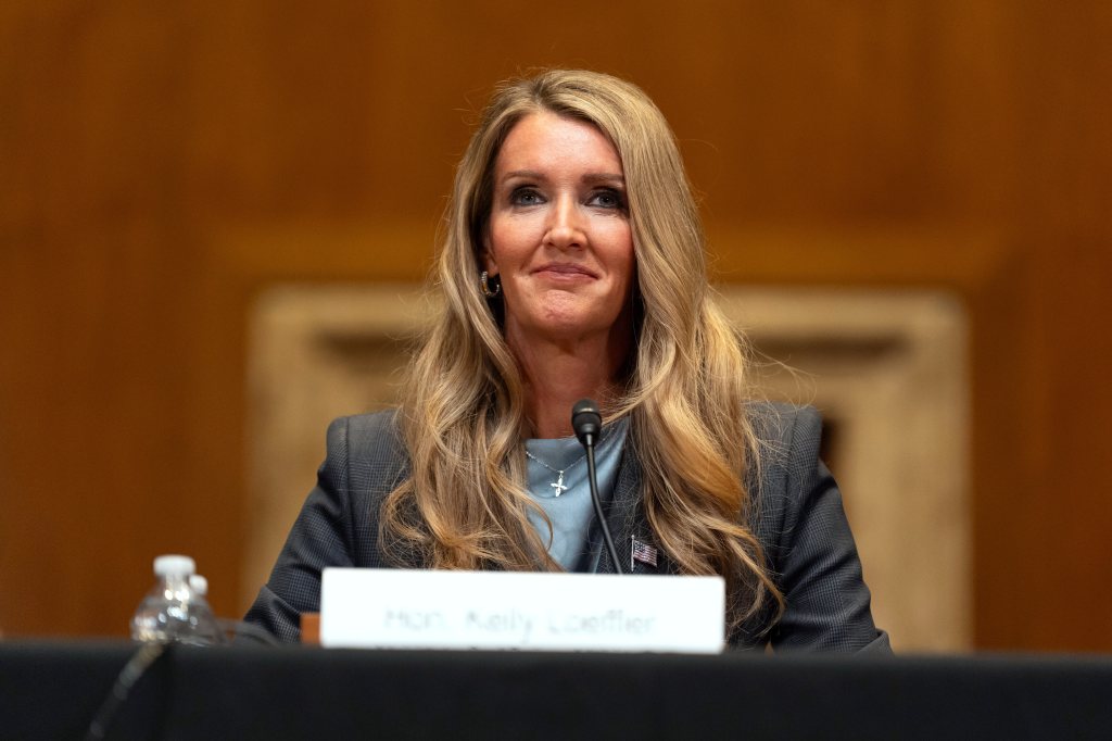 Kelly Loeffler, leader of the Small Business Administration, attentively listening during a Senate Committee hearing on Capitol Hill, dated May 21, 2025.