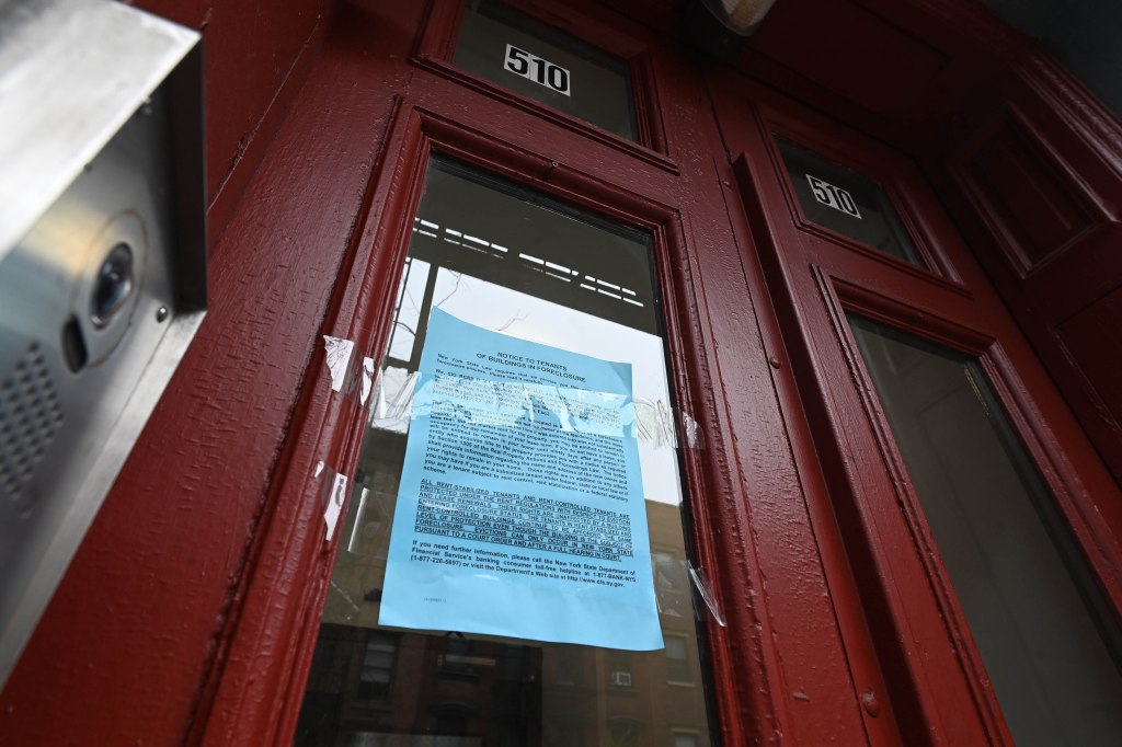 Foreclosure notice on the front door of the building at 510 East 12th Street in East Village, New York.