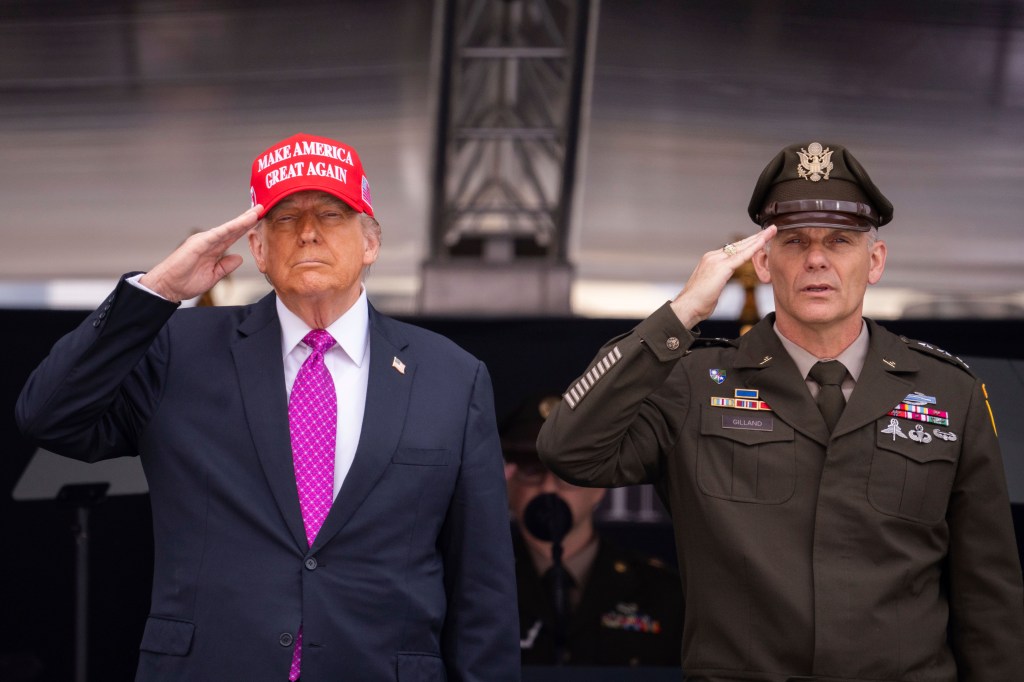 Trump salutes alongside U.S. Military Academy Superintendent Lt. Gen. Steven W. Gilland during commencement ceremonies.