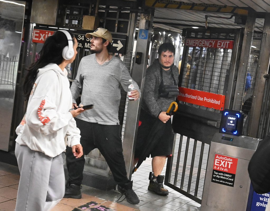 A photo shows a man sneaking through the emergency gate this week in the Herald Square station.