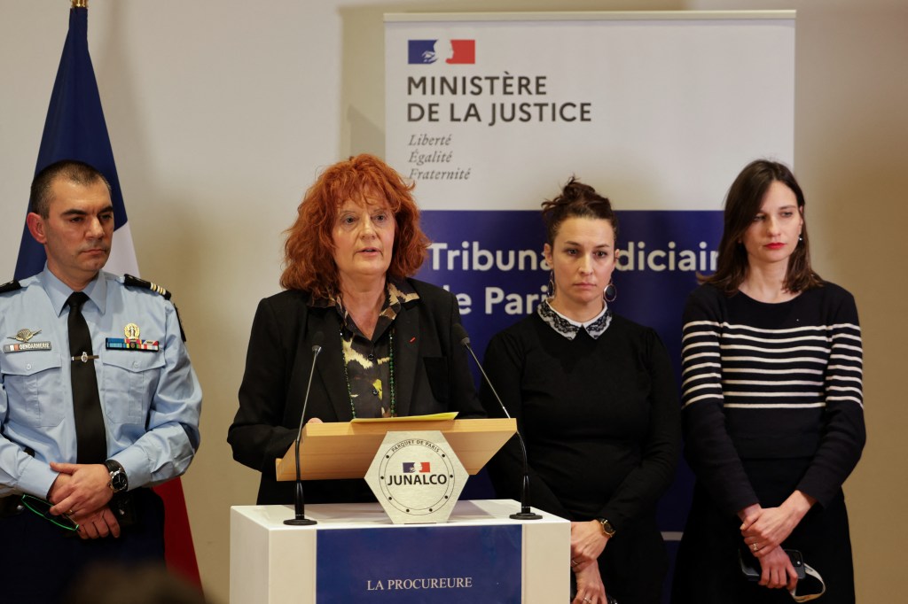 The prosecutor in Paris standing at a podium.