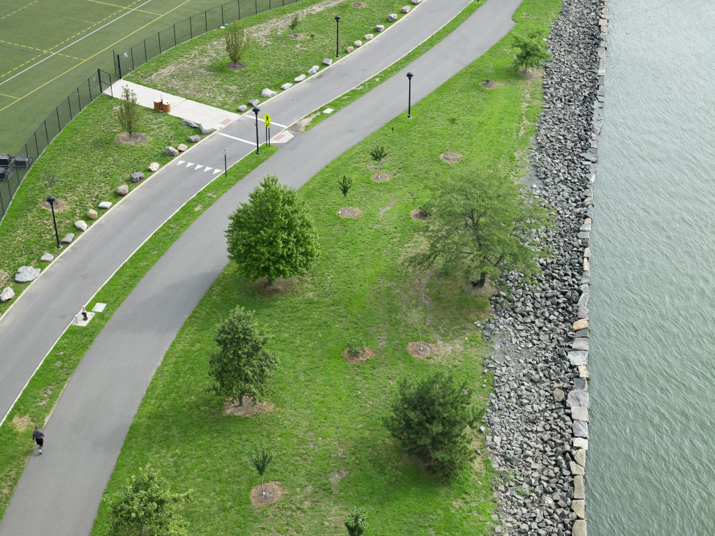 A bird's eye view of the bike path and the rocky shoreline on Randall's Island.