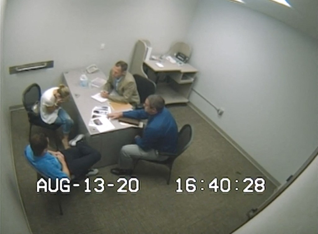 Sherri Papini breaking down in tears during the revelation of her kidnapping hoax by investigators, with husband Keith Papini beside her.