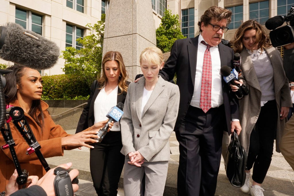Sherri Papini and her attorney William Portanova exiting the federal courthouse in Sacramento, California, after her arraignment on April 13, 2022.