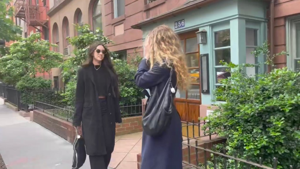 folchi and another woman on the sidewalk in chelsea the other woman has turned away from the camera