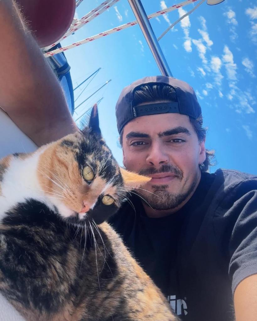 Oliver Widger and his cat arrived in Hawaii on Saturday.