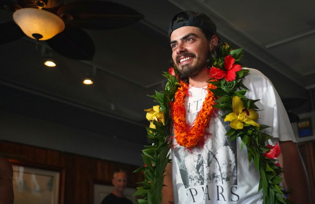 Cheering fans welcomed Widger and his cat when they completed their long journey.