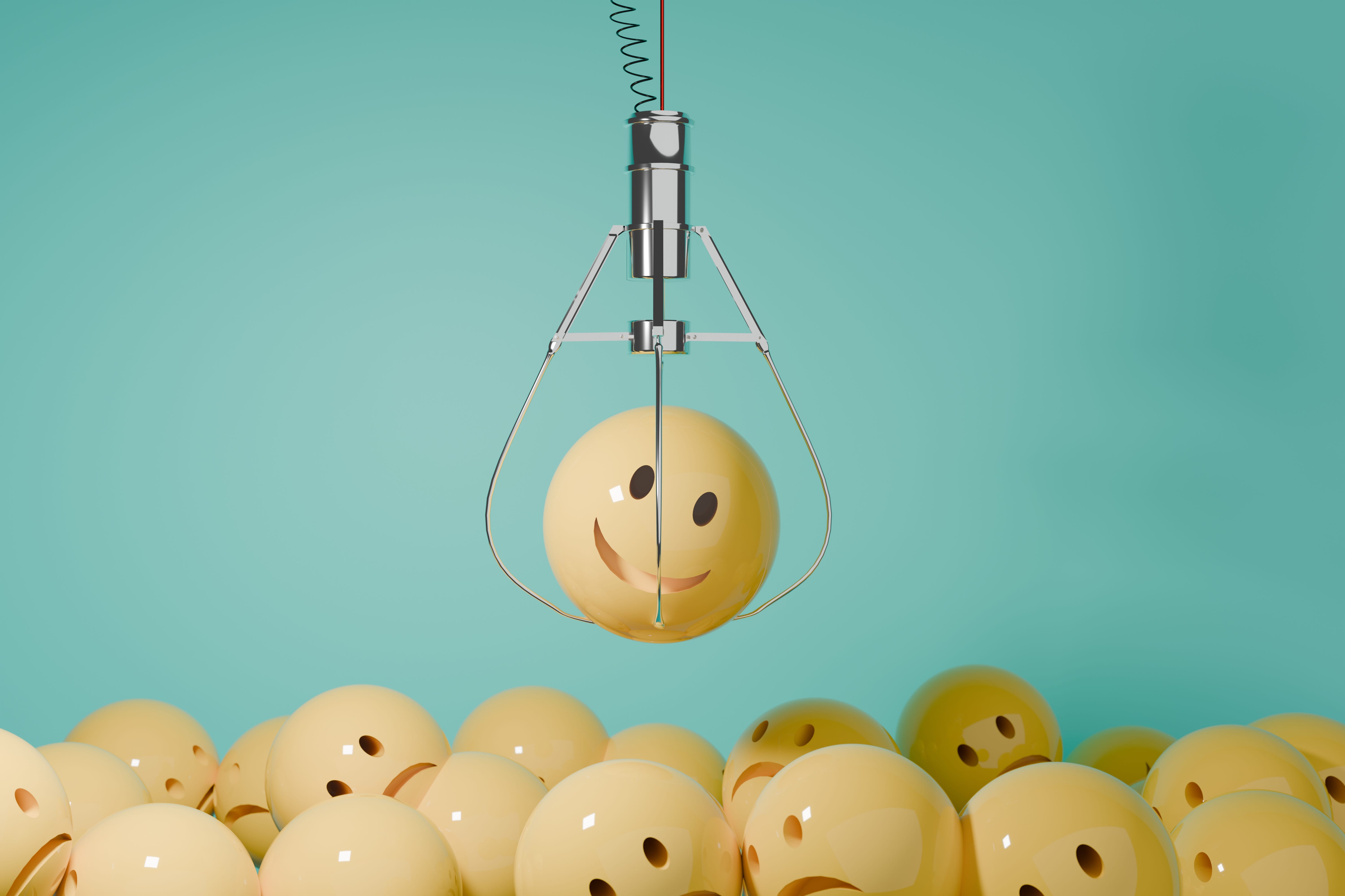 claw machine holding a smily face toy