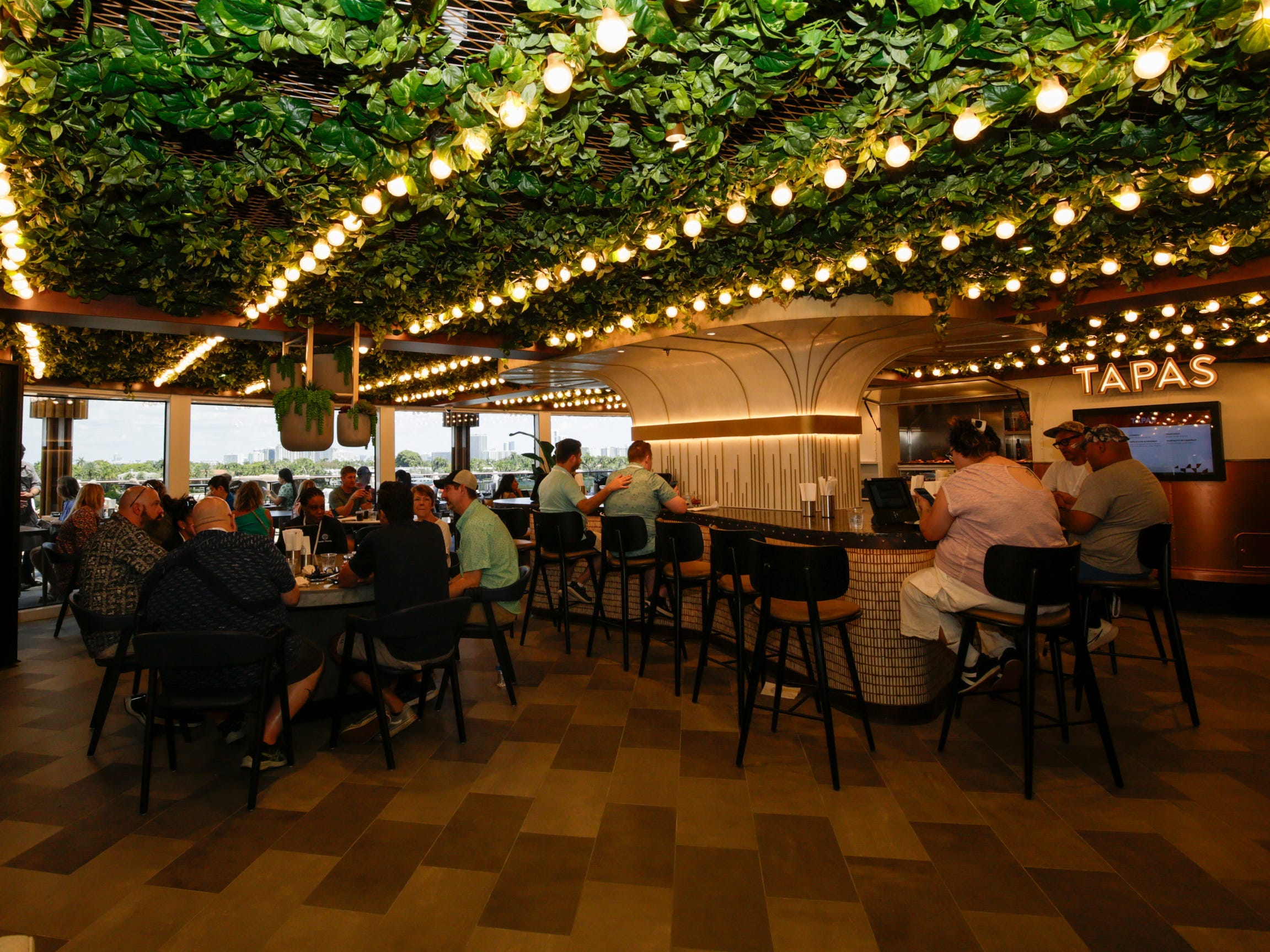 people sitting at Indulge Food Hall on Norwegian Aqua