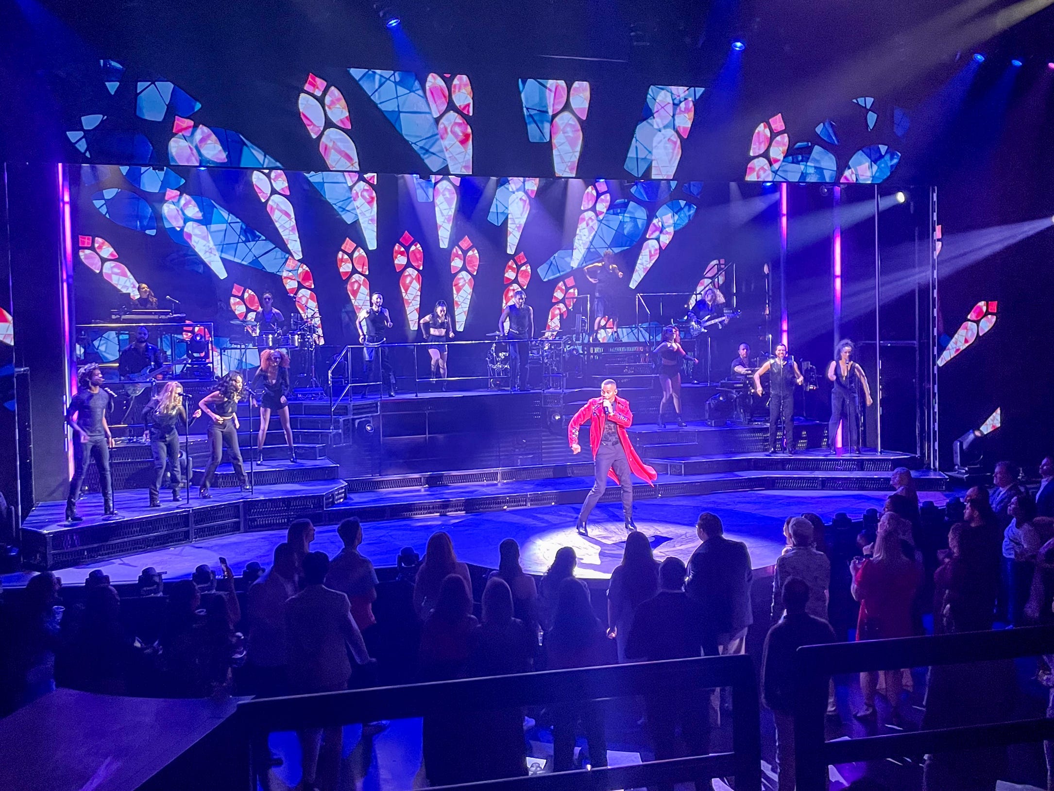 "Revolution: A Celebration of Prince" show on stage on Norwegian Aqua has people standing on the floor look on