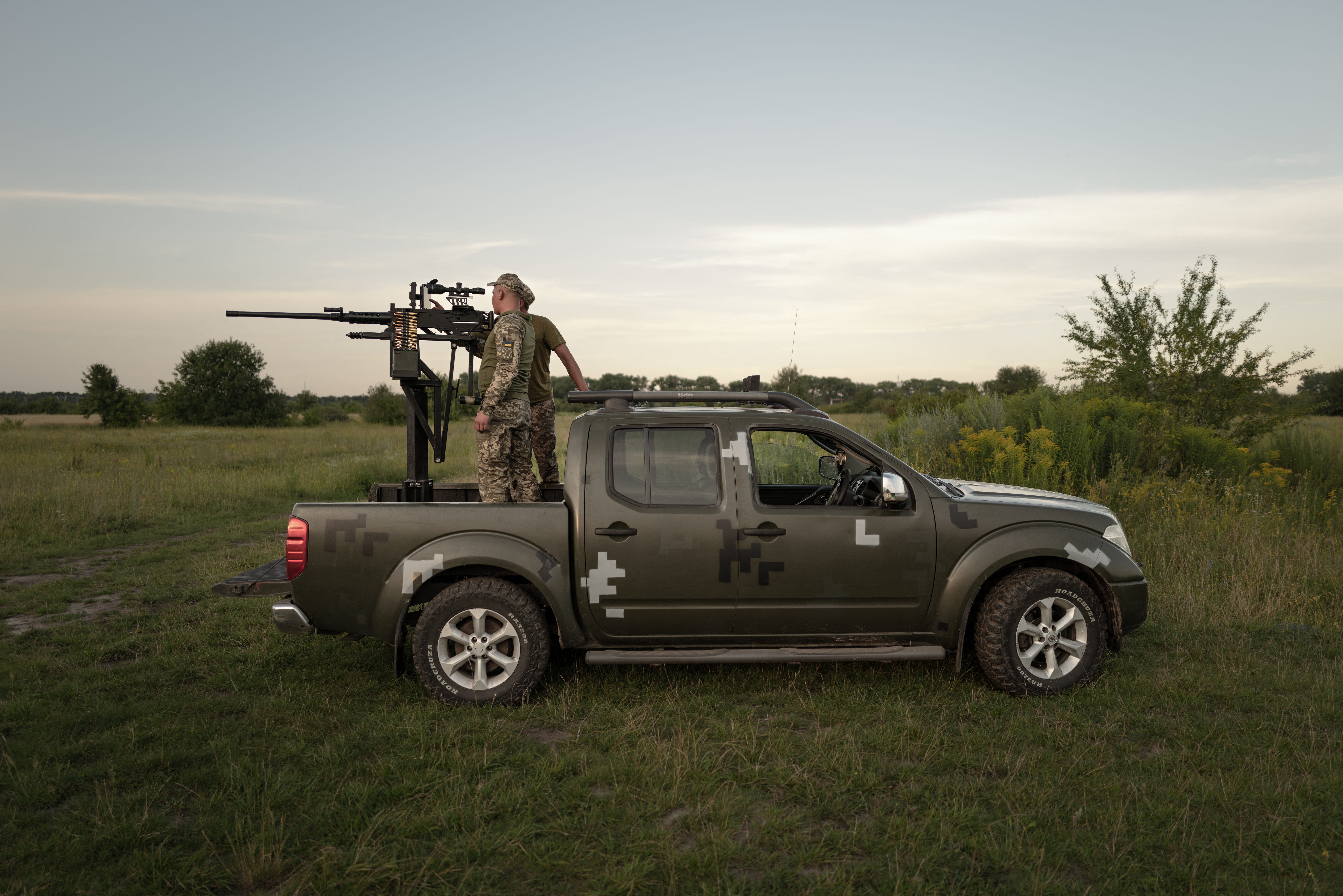 Soldiers of a mobile anti-aircraft brigade prepare a 12.7mm calibre heavy machine gun near a training field in the Khmelnytsky region, on July 8, 2024.