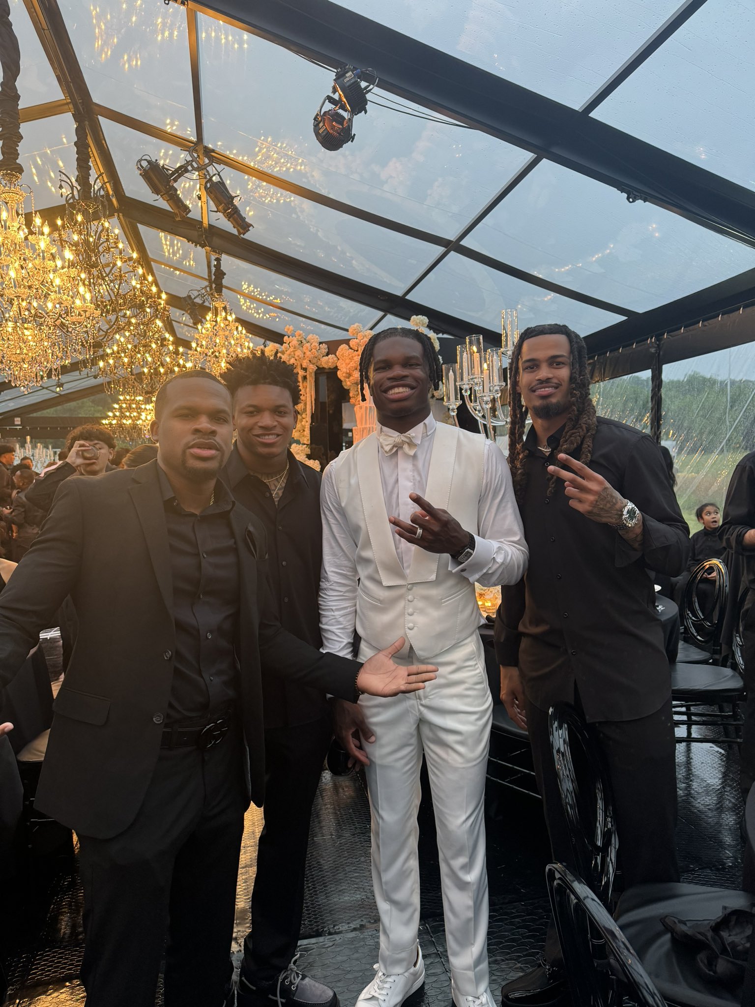 Travis Hunter with guests at his wedding