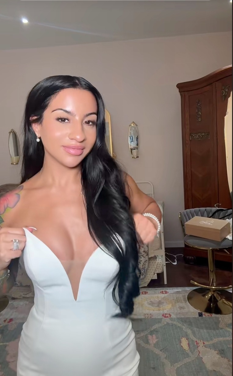 Leanna Lenee in a white dress