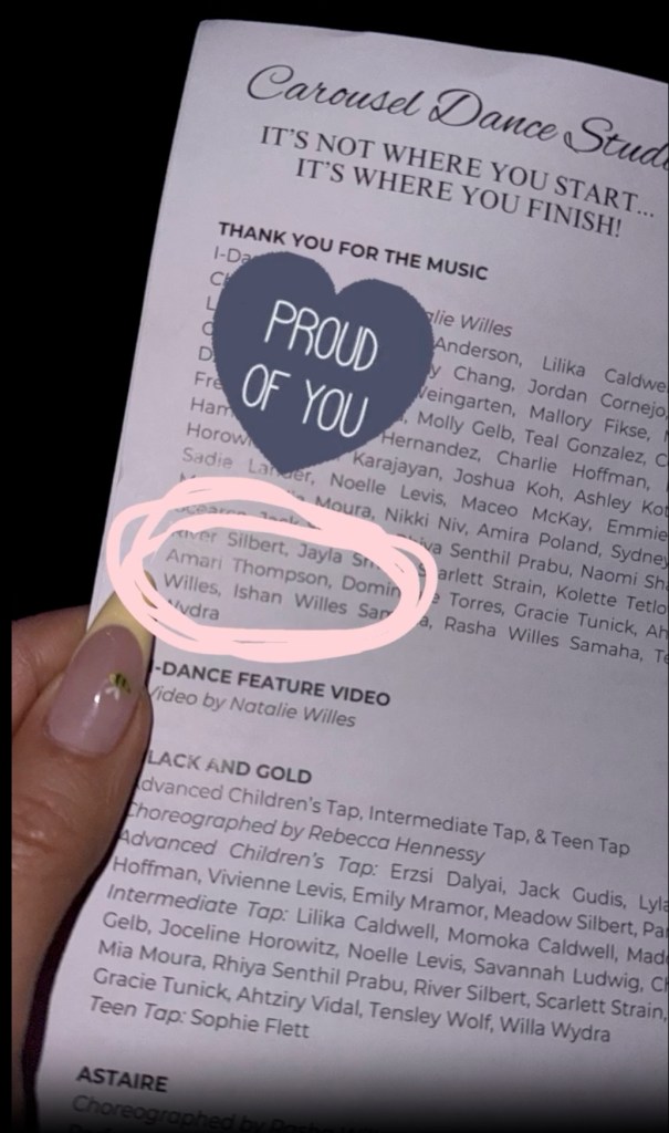 Khloe Kardashian holding a dance recital pamphlet