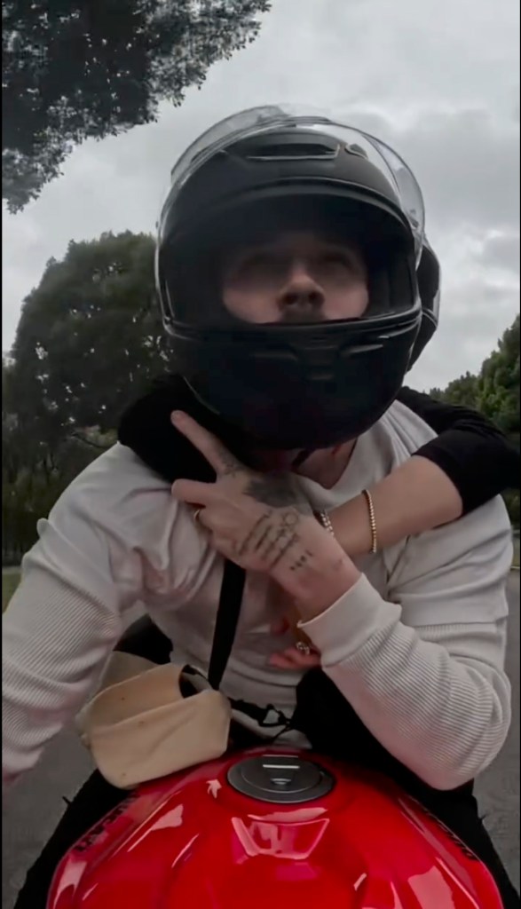 Brooklyn Beckham and Nicola Peltz on a motorcycle.
