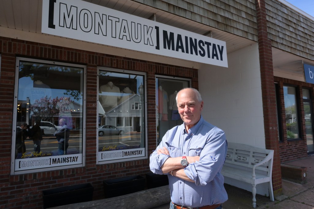 Peter Moore age 69 front of his his store
