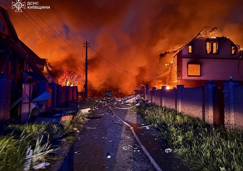 Ukrainian firefighters battling fires in residential area after Russian airstrikes in the Kyiv region, Ukraine, with reported casualties, on May 25, 2025.