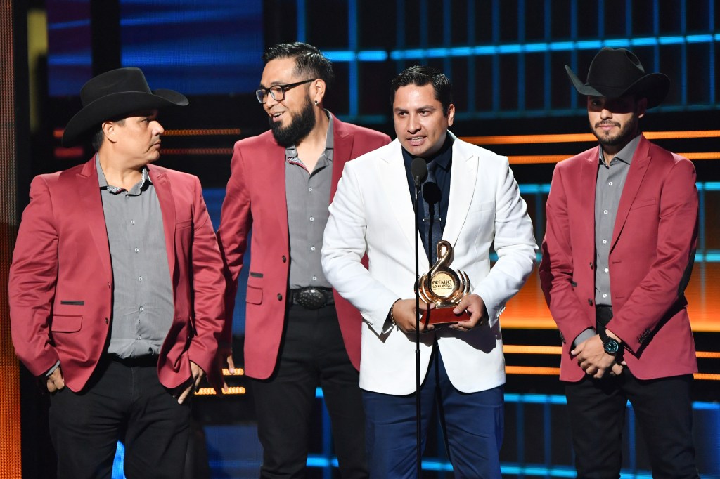 Julion Alvarez (CR) and his band recieve award onstage during Univision's 29th Edition of Premio Lo Nuestro A La Musica Latina at the American Airlines Arena on February 23, 2017 in Miami, Florida.