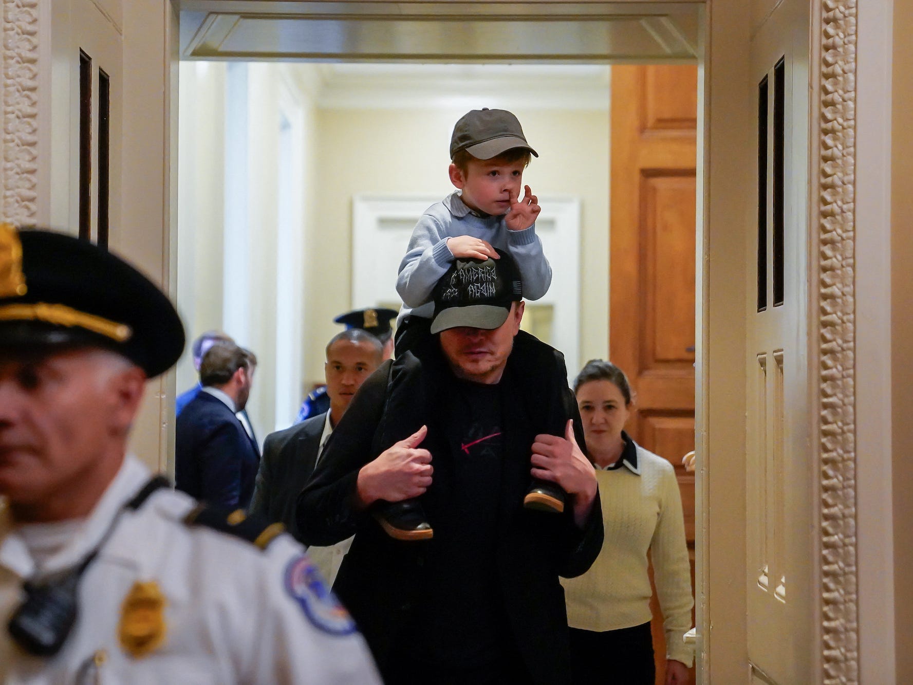 Musk with his son, X Æ A-12, after meeting with senators at the Capitol on Wednesday.
