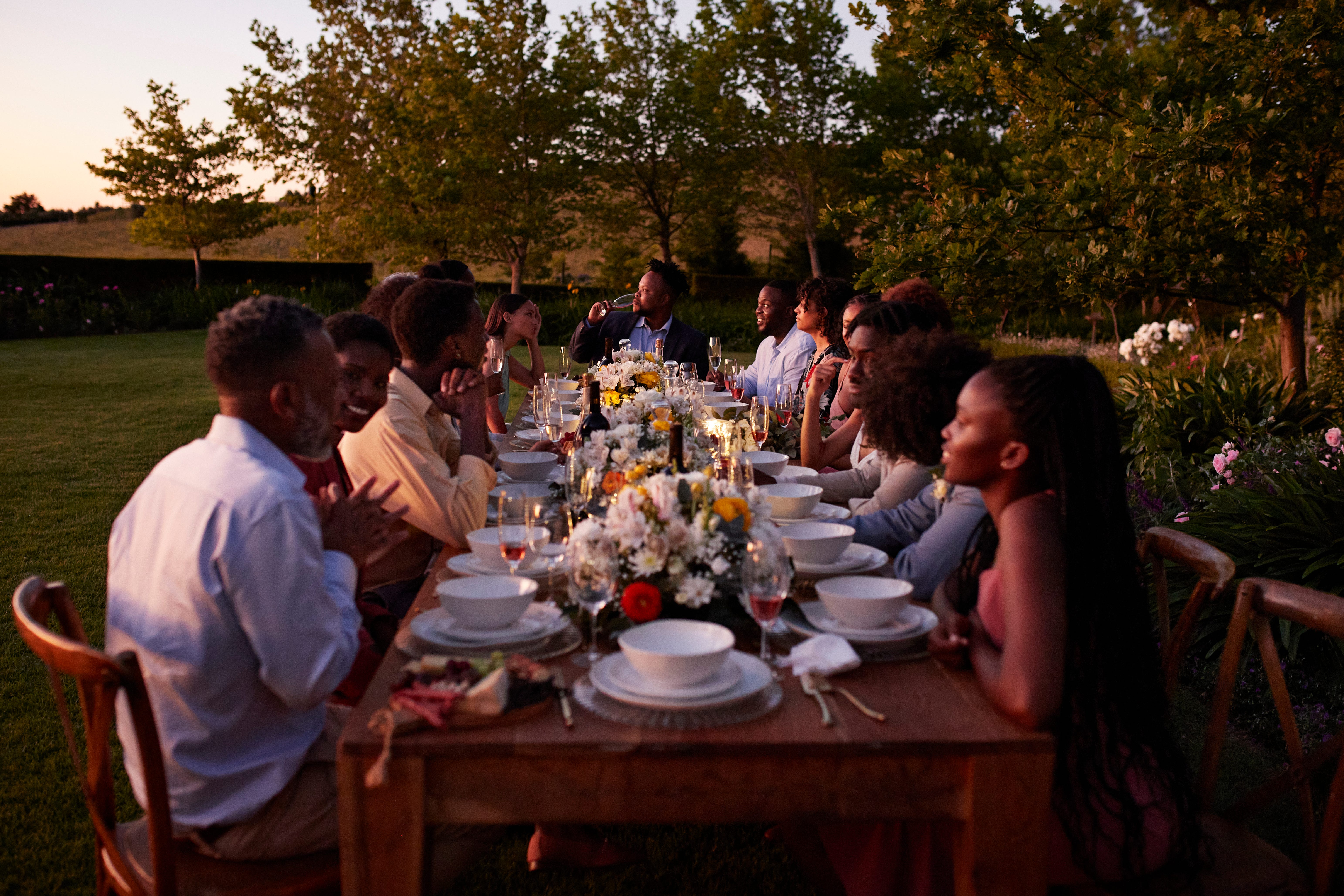 Wedding guests sitting around a table outdoors