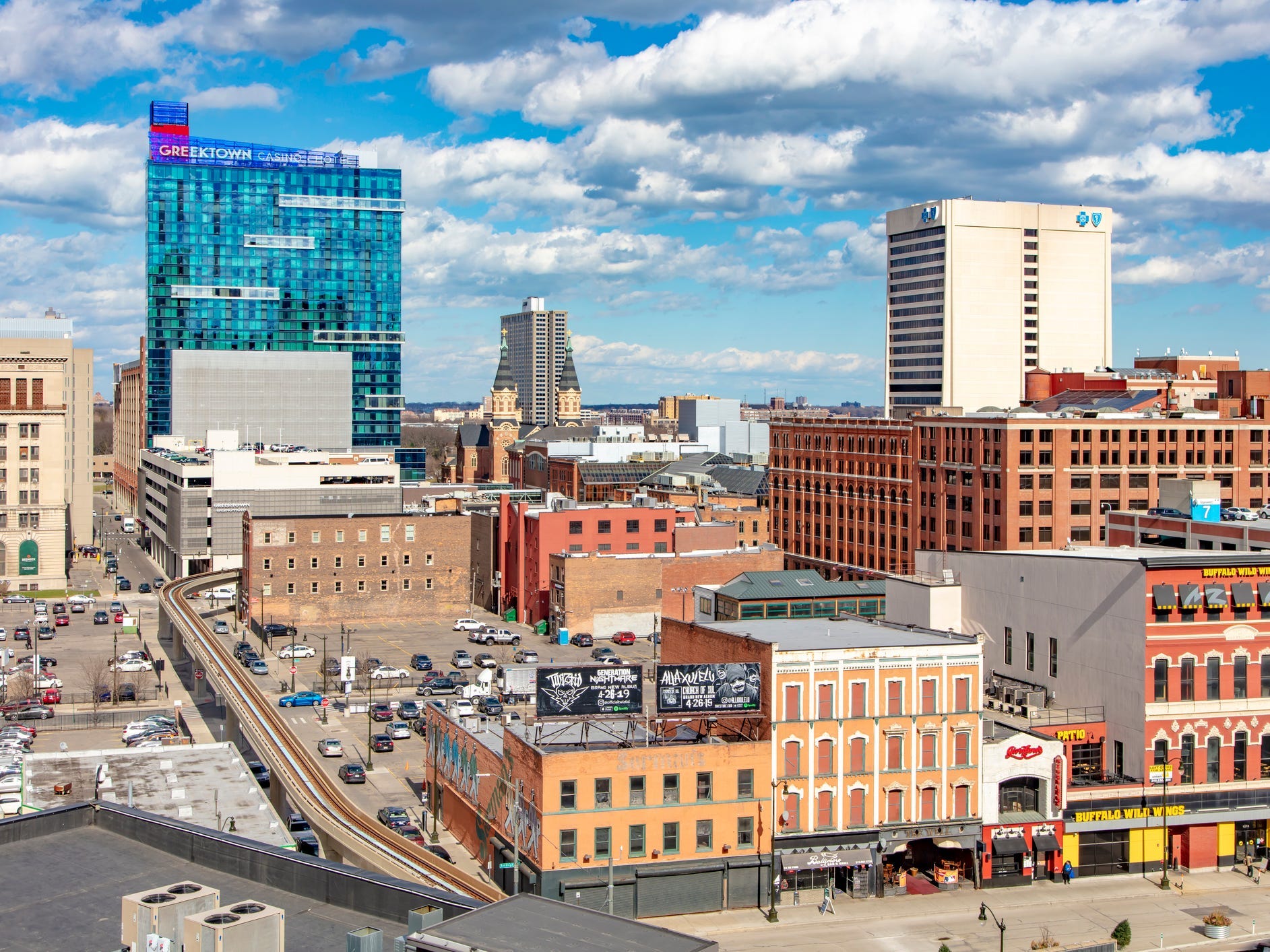Angled view of Detroit, with a mix of brown buildings and modern skyscrapers