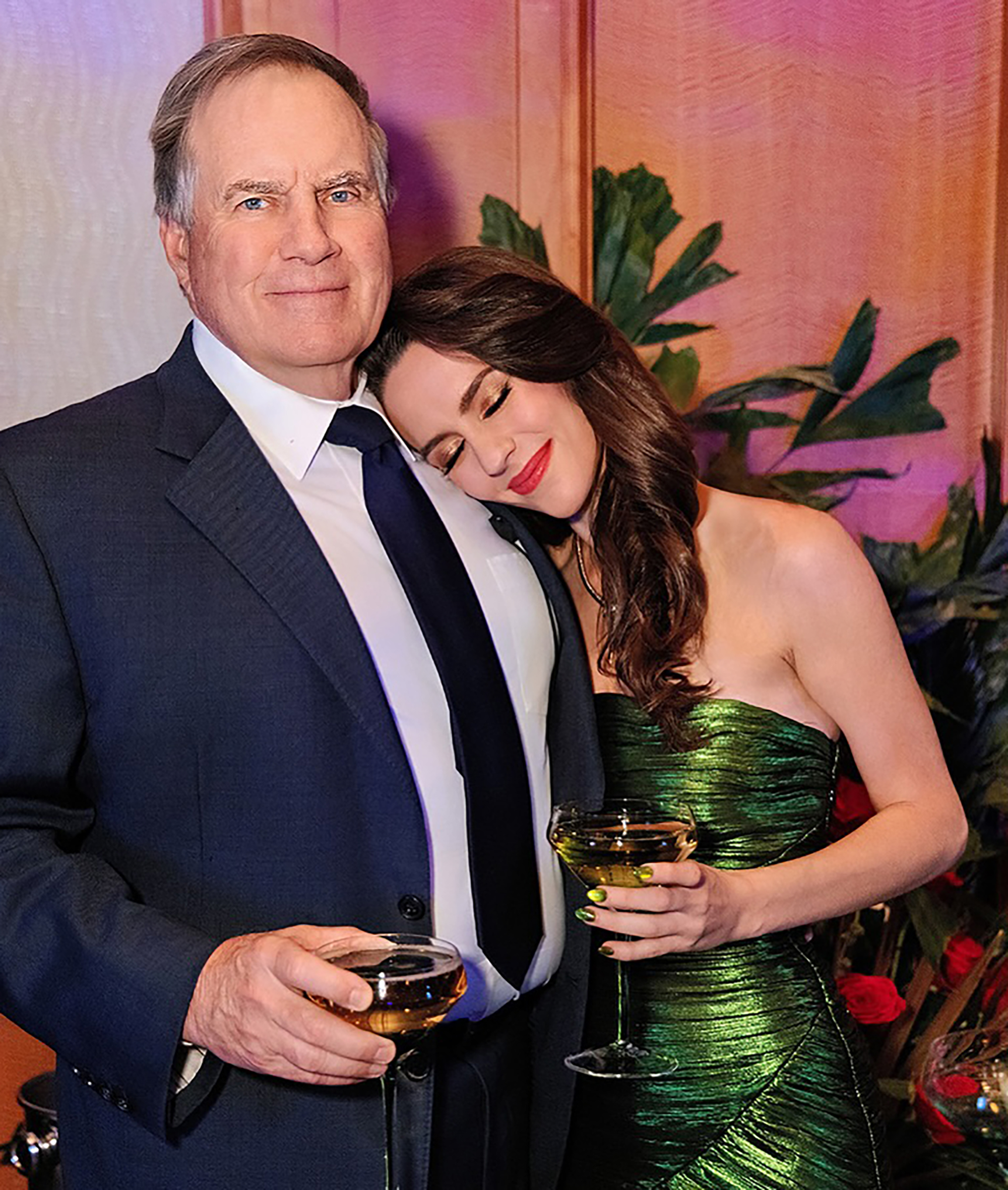 Bill Belichick and Jordon Hudson snuggling.