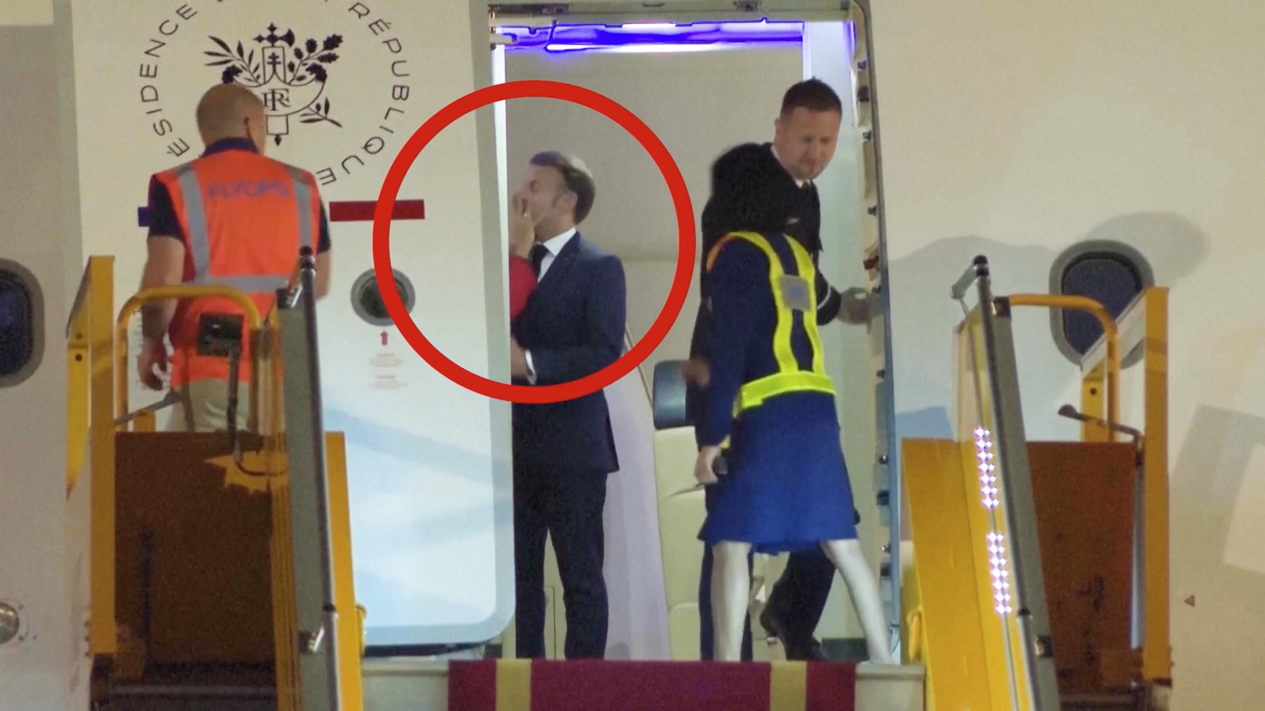 President Macron getting shoved by his wife.