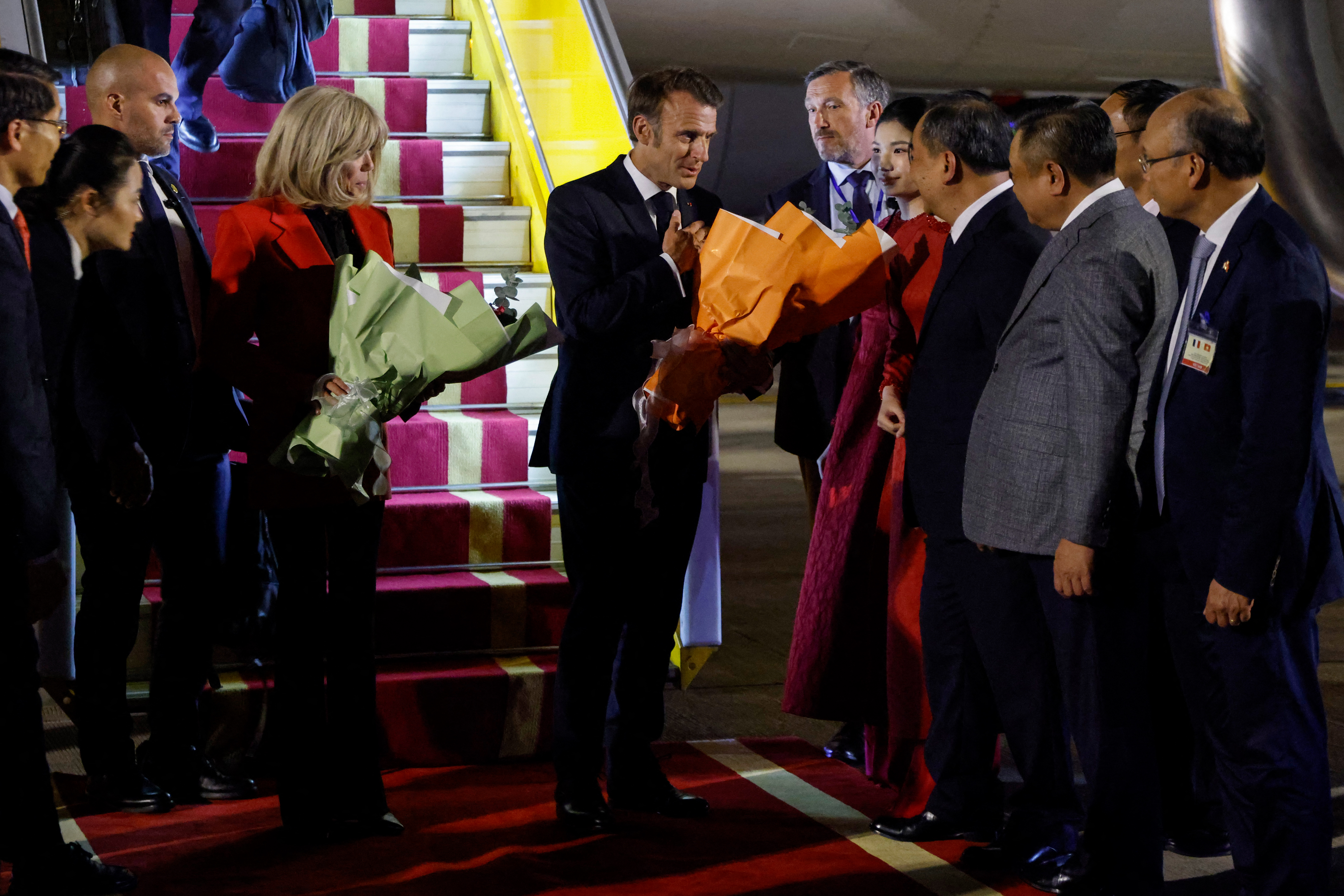 Brigitte Macron and Emmanuel Macron arriving in Vietnam.