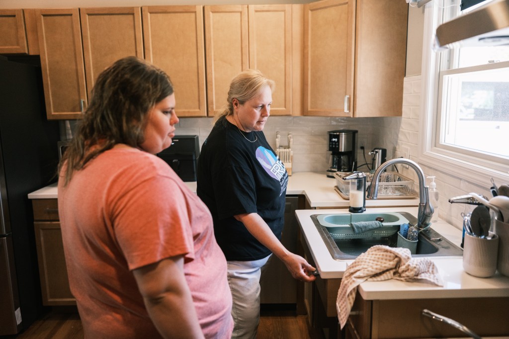 Slade getting a tour of the property by Debra Brock, the senior supervisor at Pinetop IRA.