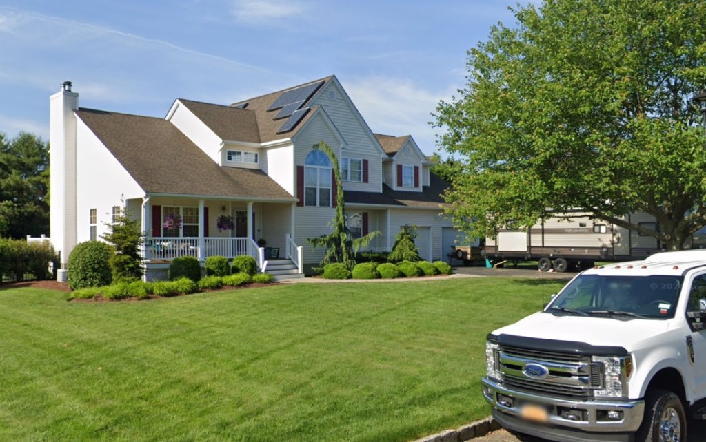 The body was found by a homeowner in backyard of their East Shoreham house.