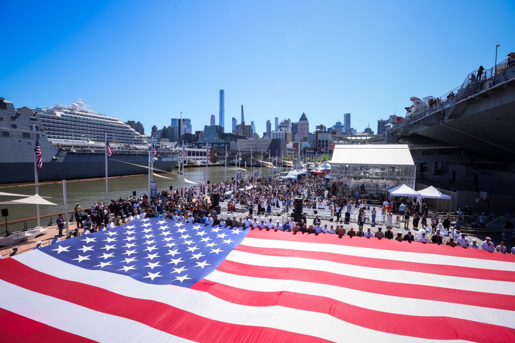 Veterans, active duty members of the armed forces and members of the public during the annual Memorial Day commemoration ceremony at the Intrepid Museum on Monday