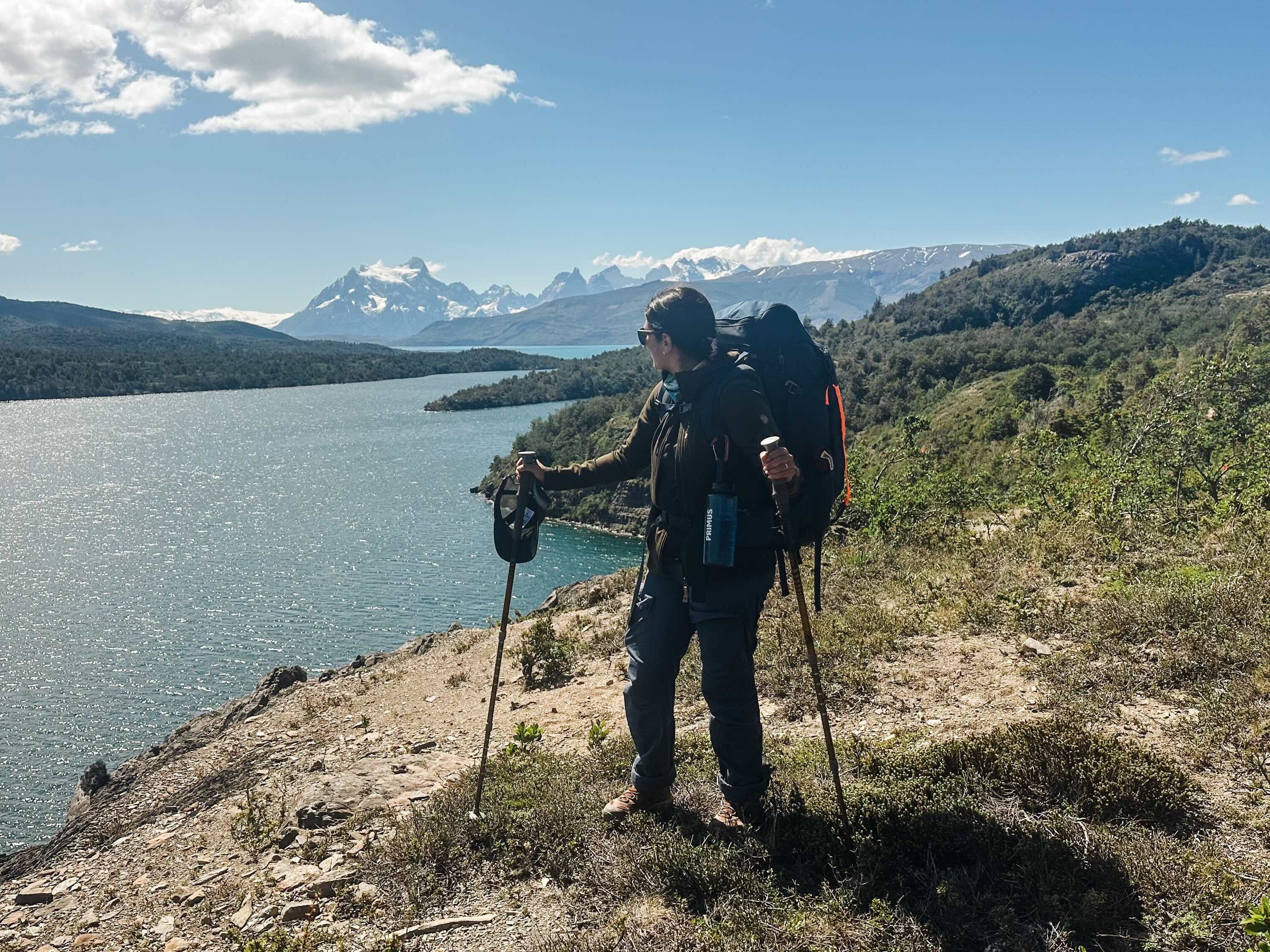 Woman with hiking poles in Patagonia.