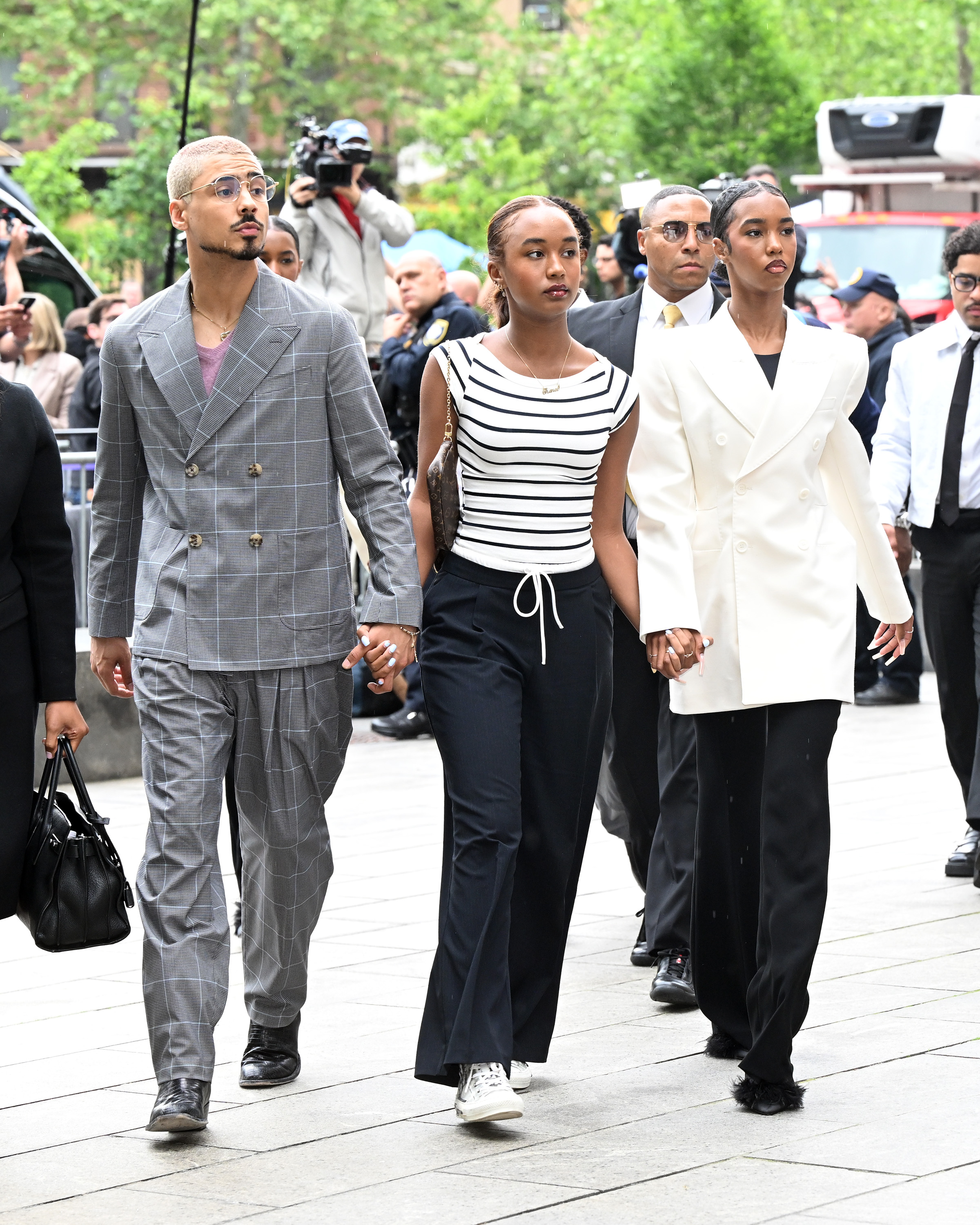 Diddy's children walking into court.