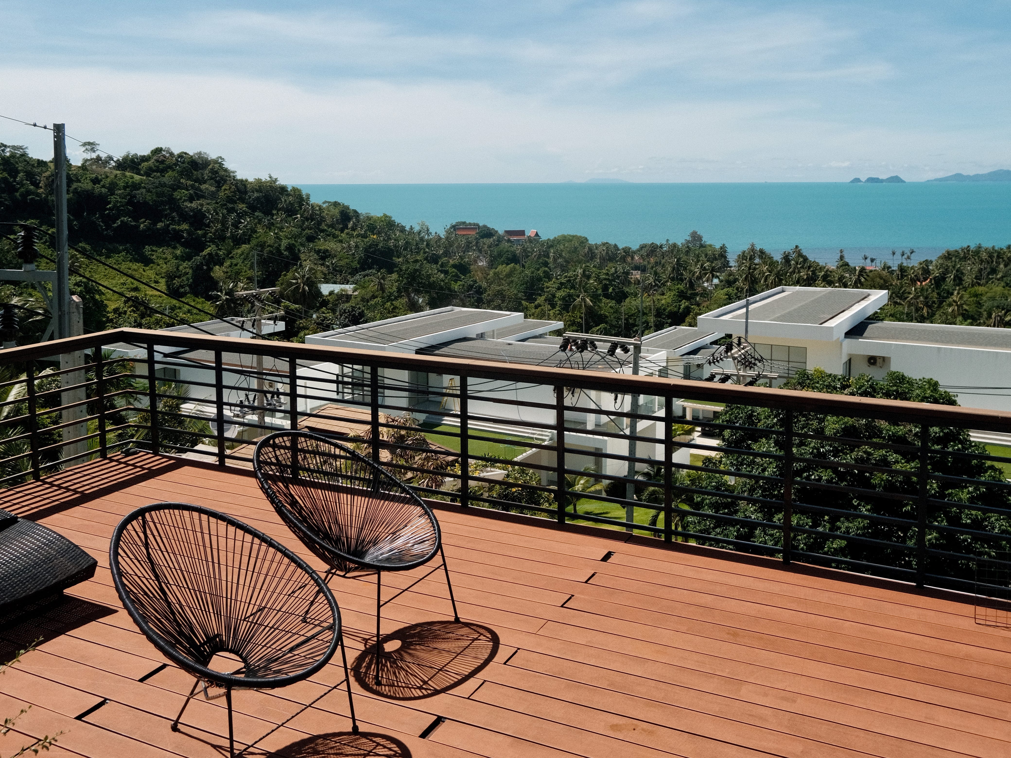 Two chairs on a terrace in a villa in Koh Samui, Thailand.