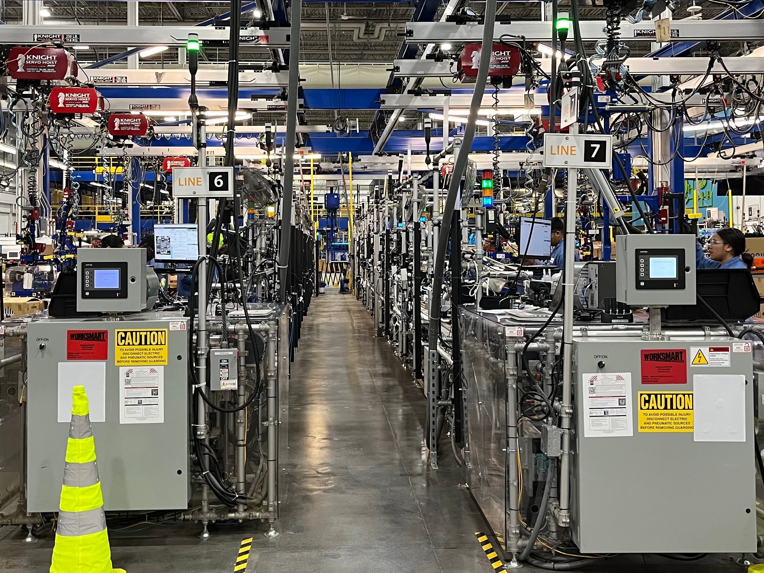 Photo shows assembly line inside Amazon Robotics facility in North Reading, Massachusetts