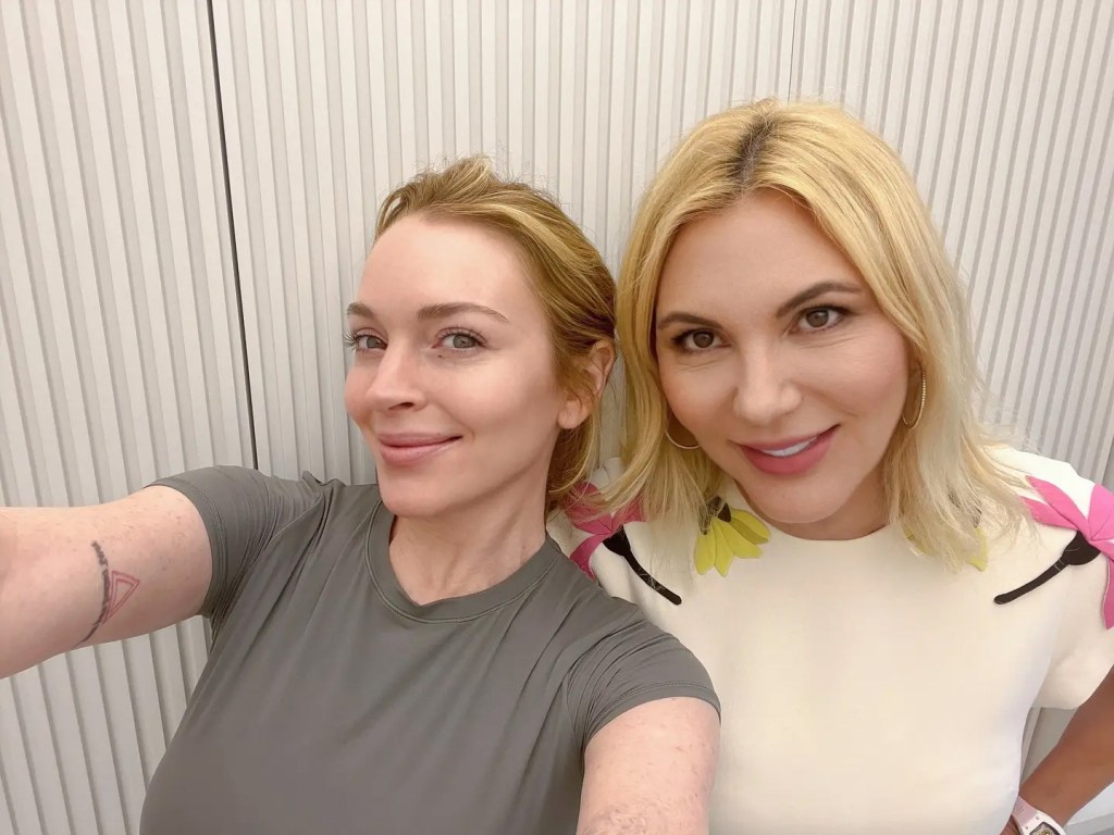 Lindsay Lohan getting a selfie with cosmetic dermatologist Dr Radmila Lukian