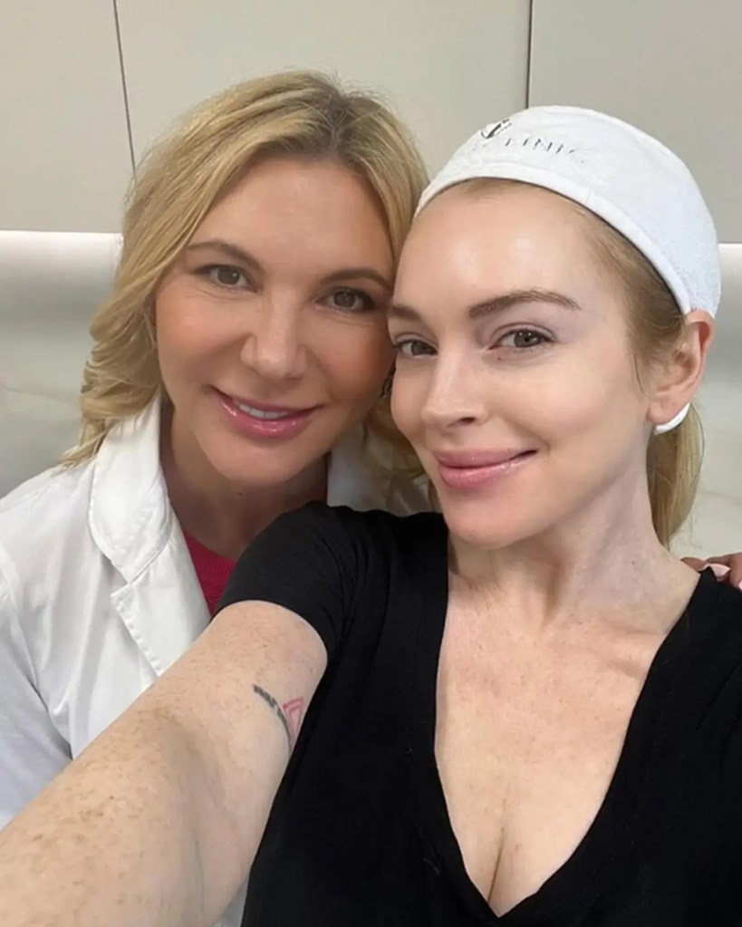 Lindsay Lohan getting a selfie with cosmetic dermatologist Dr Radmila Lukian