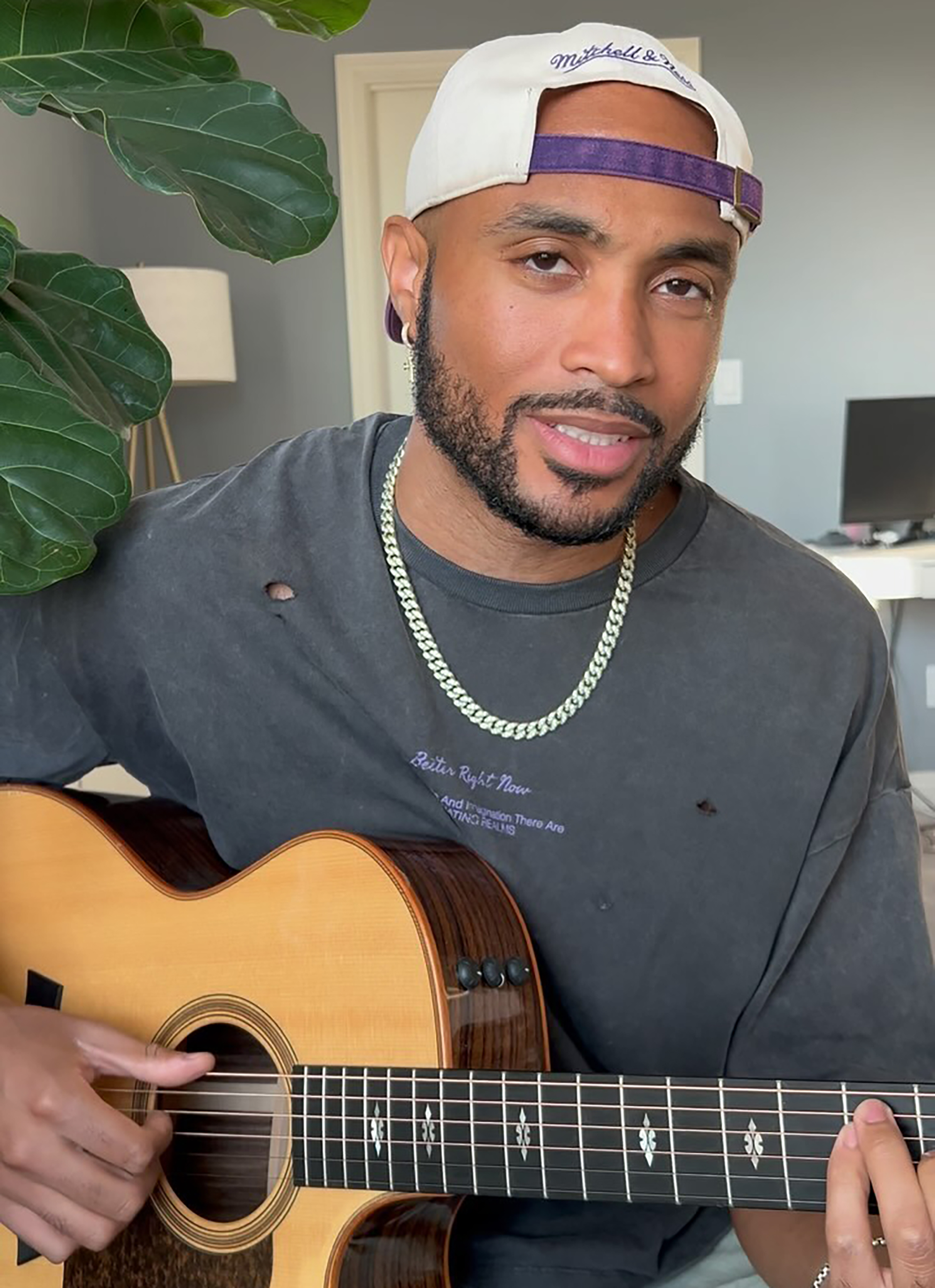 Will Gittens playing a guitar