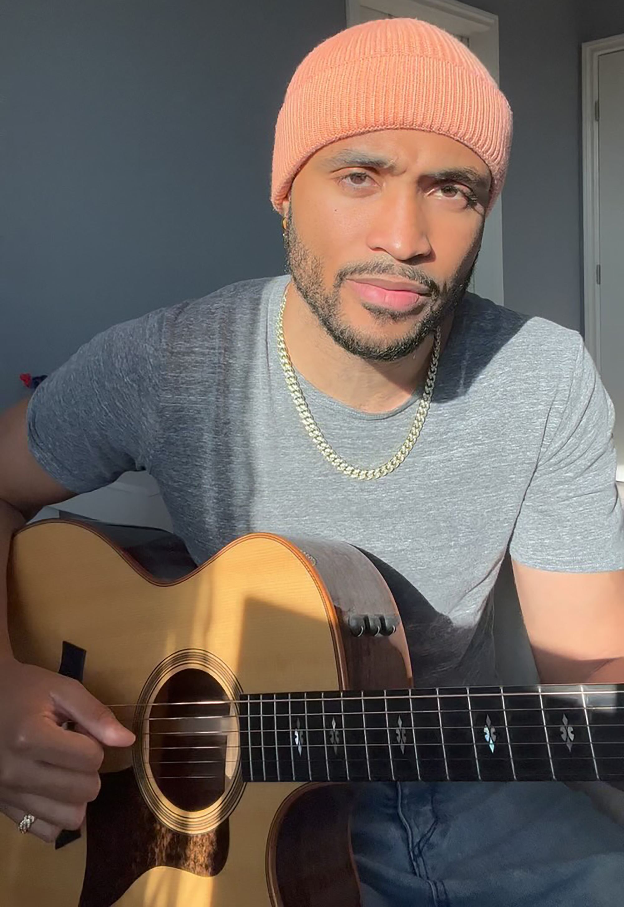 Will Gittens playing a guitar