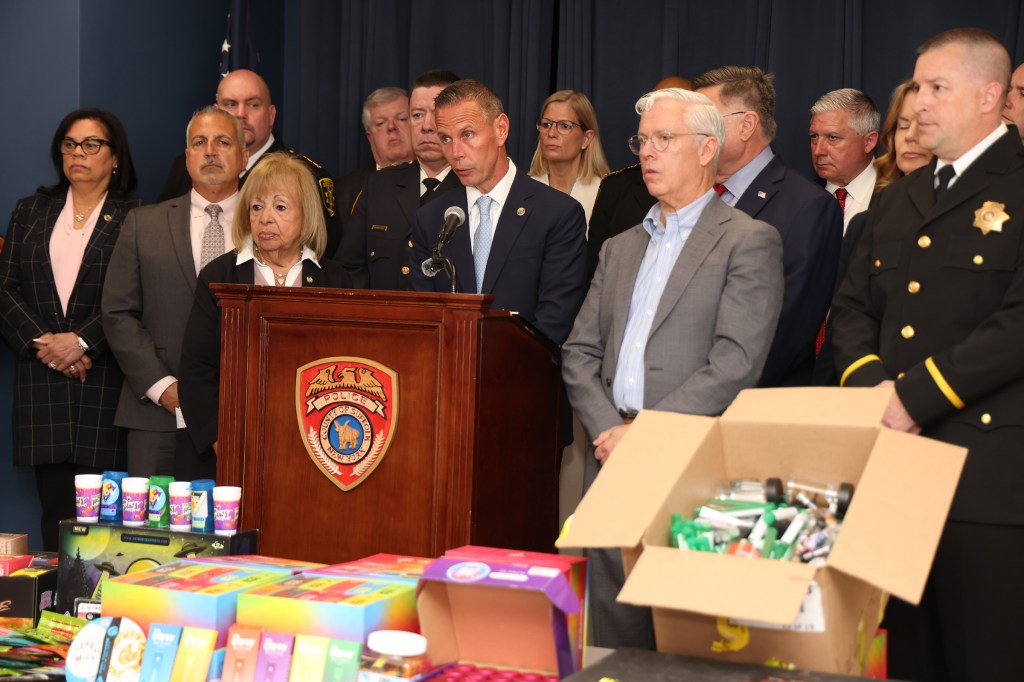 Suffolk County Executive Ed Romaine and Suffolk County Police Commissioner Kevin Catalina show off the large amount of illegal cannabis products that were confiscated throughout Suffolk County, NY in a large-scale crackdown of illegal cannabis shops