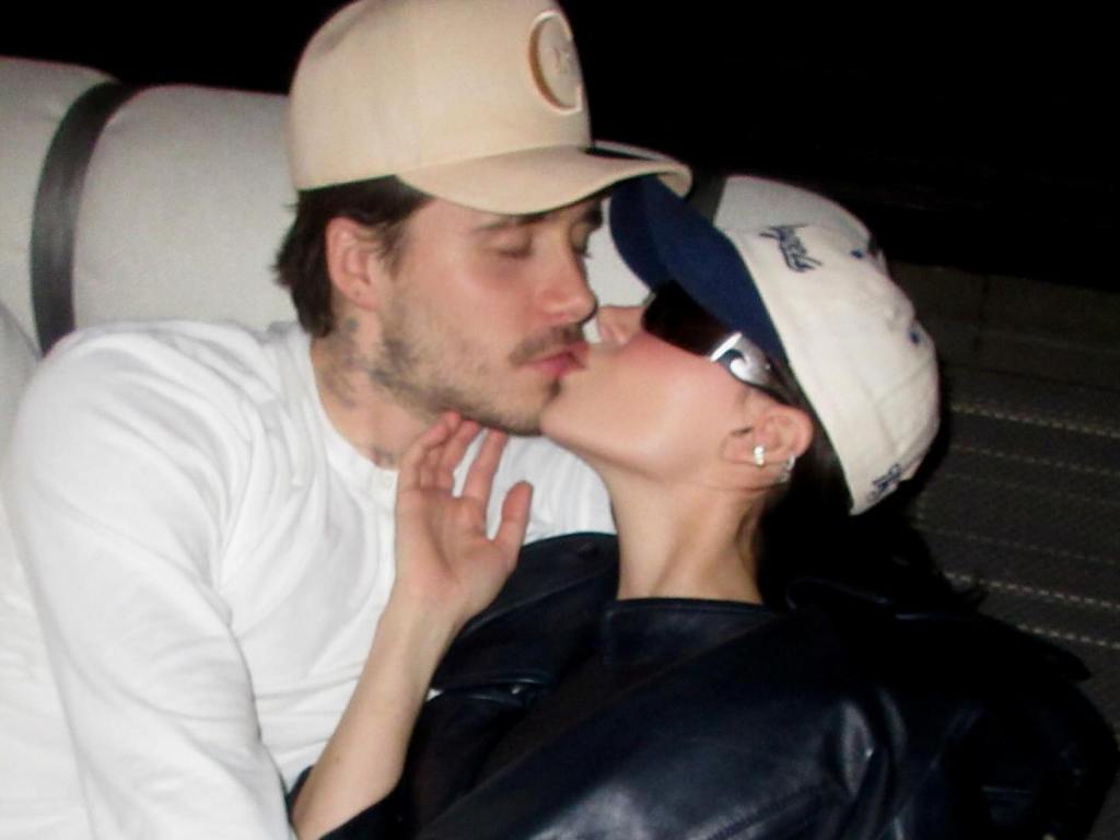 Brooklyn Beckham and
Nicola Peltz kissing in a photo.