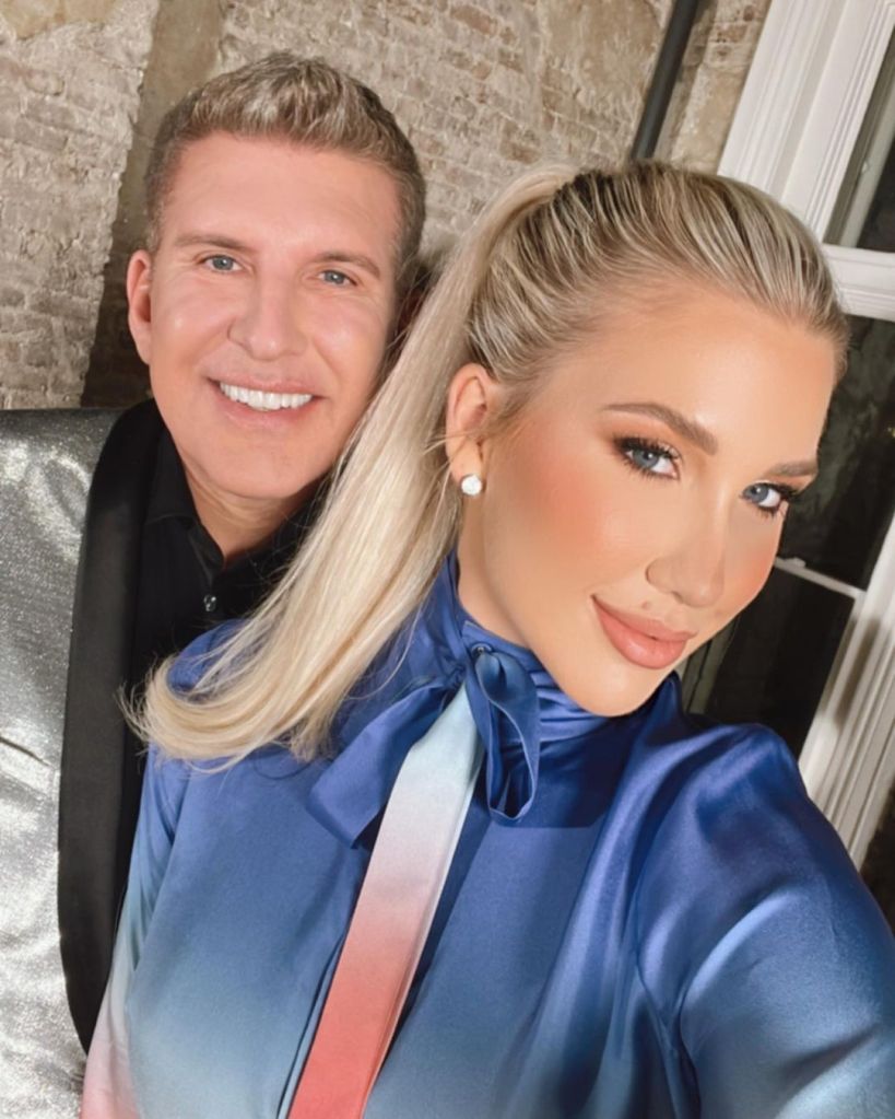 Savannah and Todd Chrisley pose for a photo..
