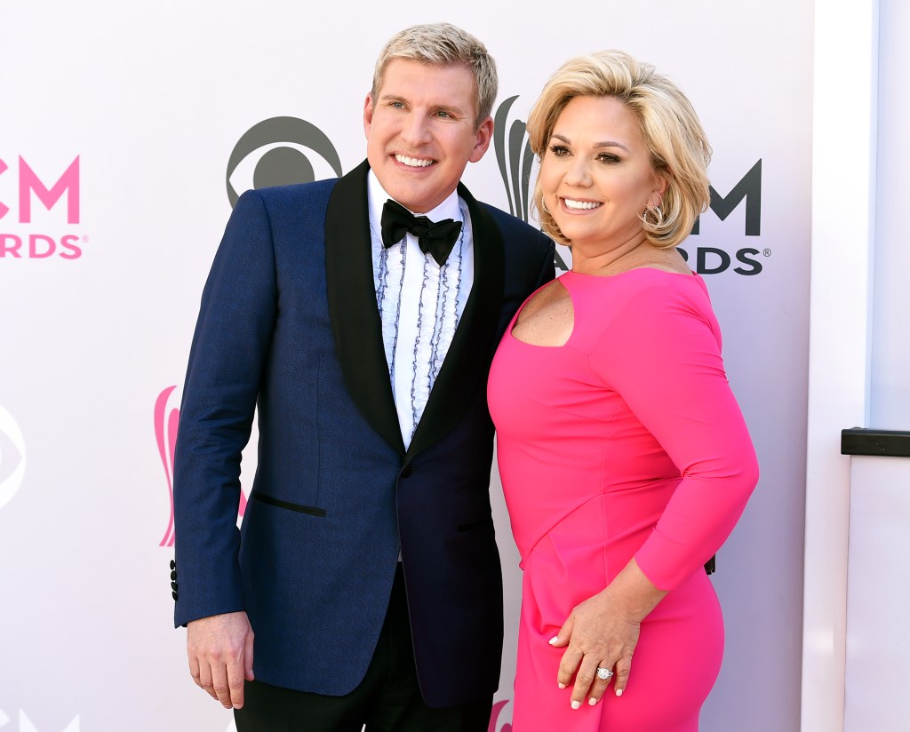 Todd Chrisley, left, and his wife, Julie Chrisley, pose for photos at the 52nd annual Academy of Country Music Awards on April 2, 2017, in Las Vegas.