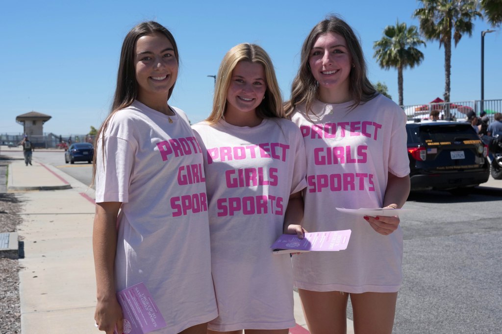 Female spectators wear Protect Girls Sports shirts during the CIF Southern Section Division 3 Track and Field preliminaries 
