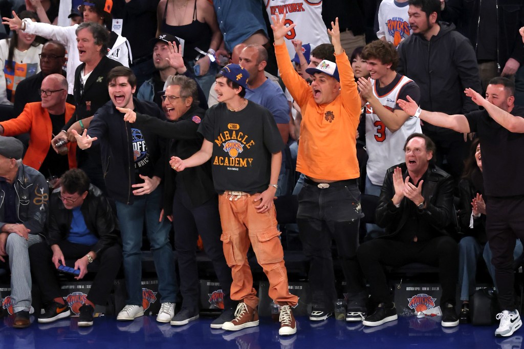 Timothée Chalamet cheering courtside