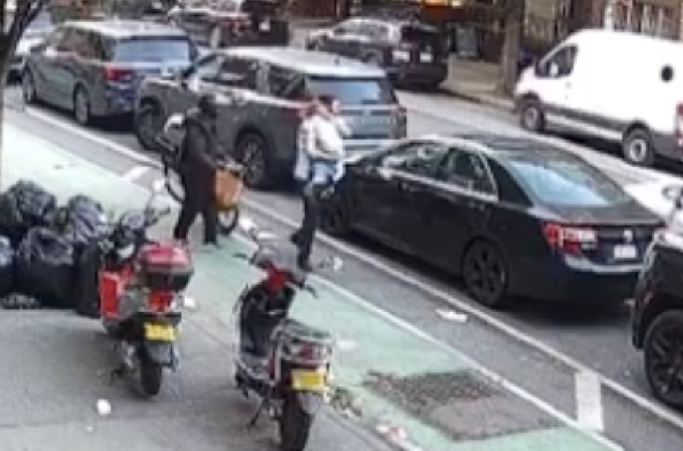 3-year-old girl stepping out of a double-parked car into bike lane, moments before being hit by an e-bike rider in South Williamsburg on May 25, 2025