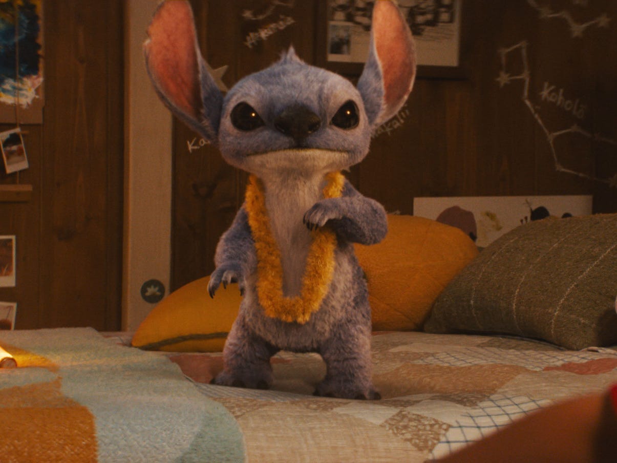 A still from "Lilo & Stitch" showing a blue alien in a bedroom.