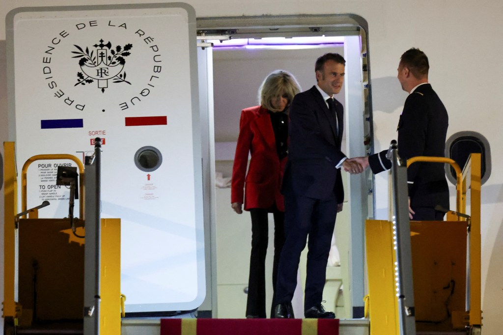 Emmanuel Macron and Brigitte Macron on airplane in Hanoi, Vietnam Sunday. 