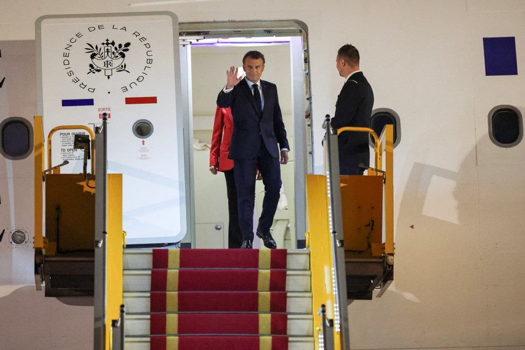 Emmanuel Macron and Brigitte Macron on airplane in Hanoi, Vietnam Sunday. 